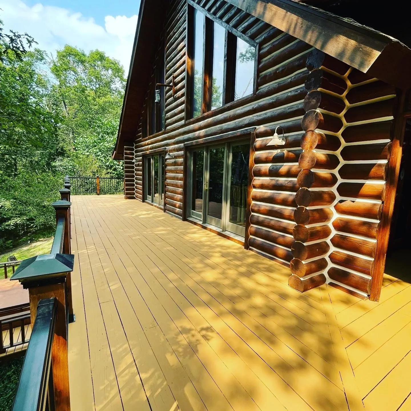 A large wooden deck with yellow paint on it.