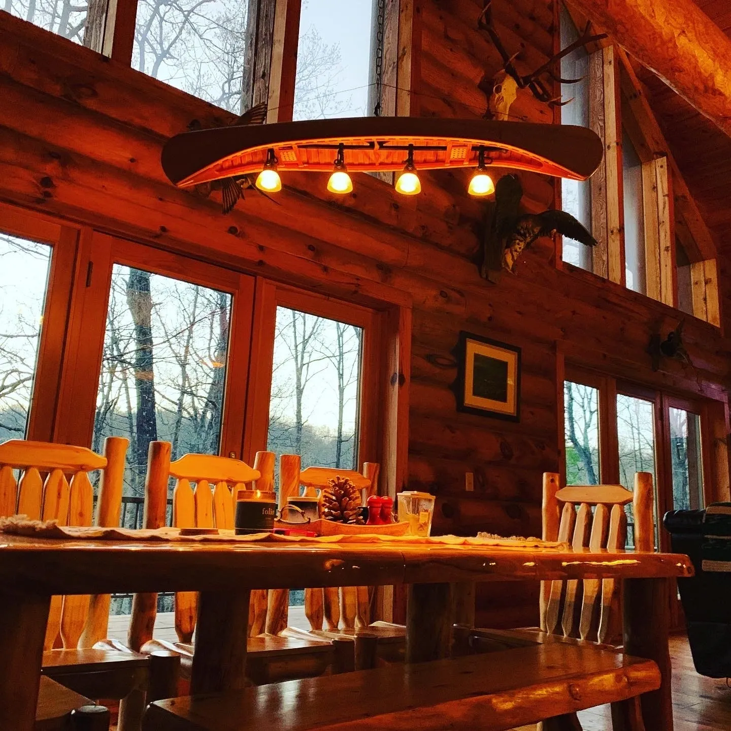 A dining room with wooden tables and chairs.