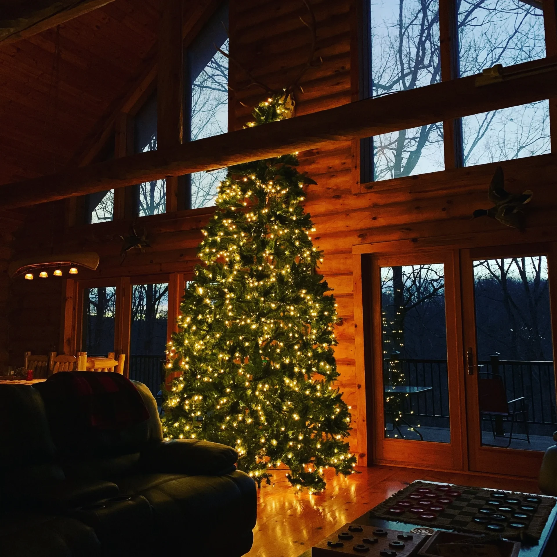 A christmas tree in the middle of a room.