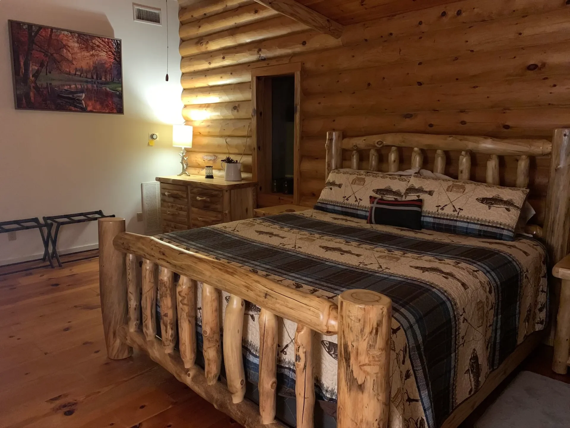 A bed room with a wooden bed and a night stand