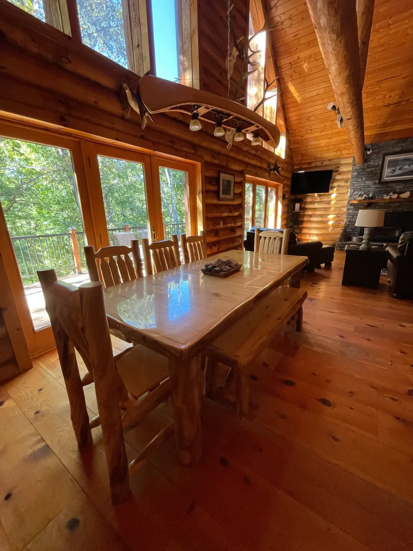 A large wooden table in the middle of a room.