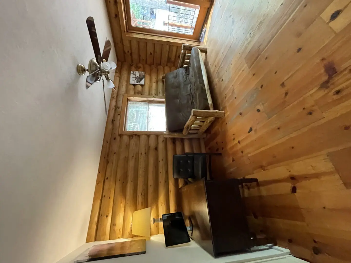 A living room with wood floors and a couch.