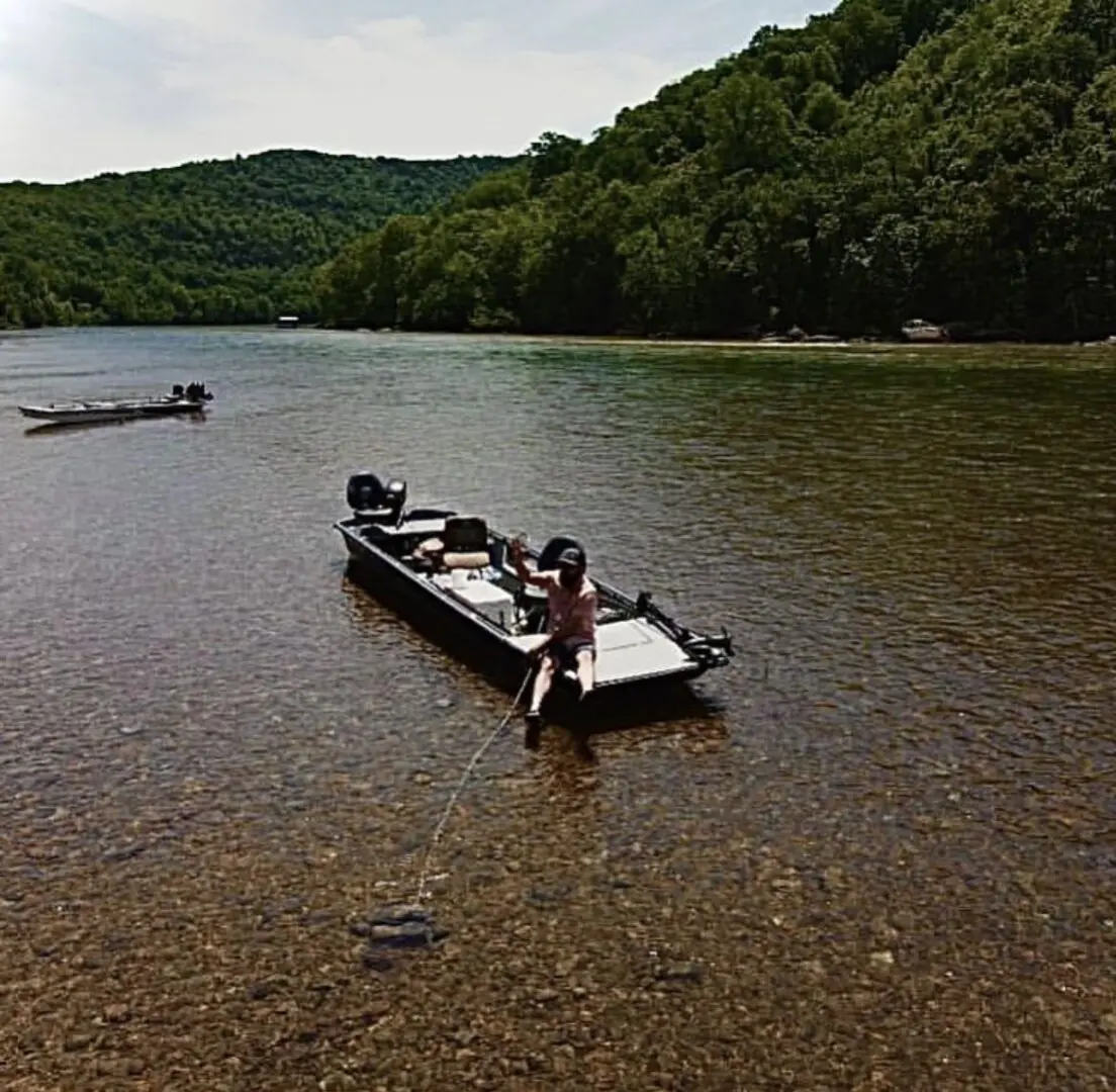 A man in a boat on the water.