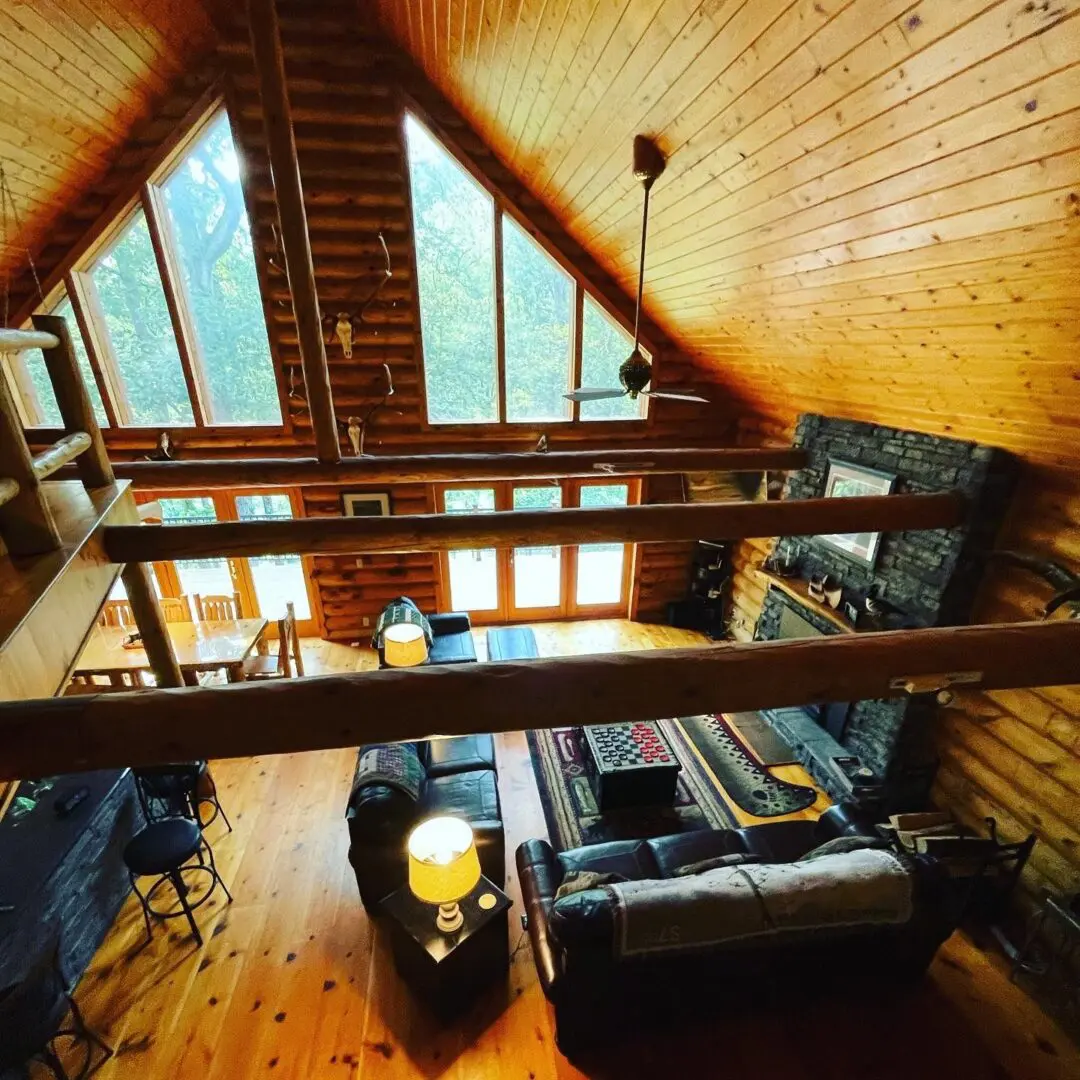 A room with wood floors and wooden walls.